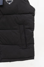 Black long padded vest with side pocket and center seam zipper