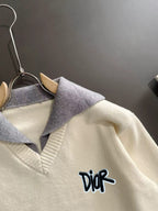 Cream sweater with light blue ribbed collar and Dior script logo detail