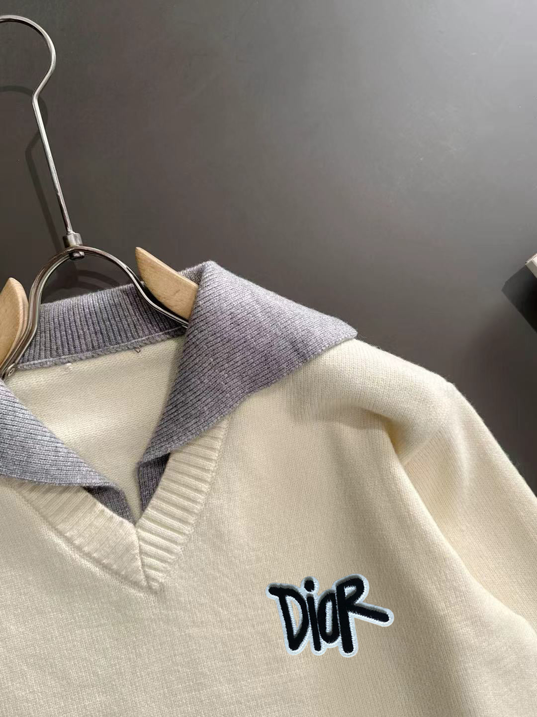 Cream sweater with light blue ribbed collar and Dior script logo detail