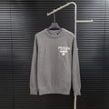 Prada long-sleeve sweater in heather gray with crew neck and PRADA Milano chest logo.
