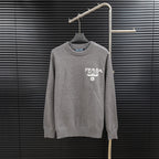 Prada long-sleeve sweater in heather gray with crew neck and PRADA Milano chest logo.