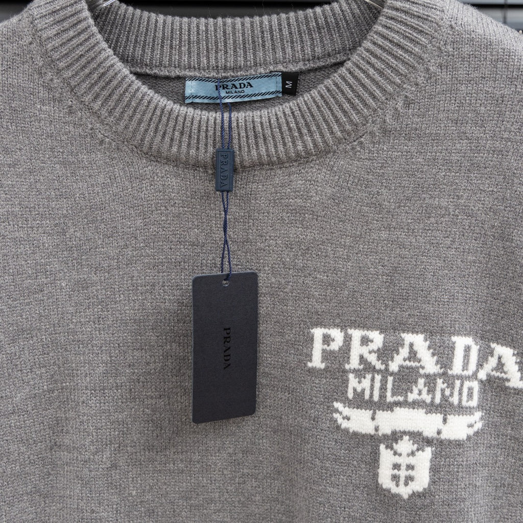 Prada heather gray sweater crew neck with inner label and hanging brand tag.