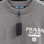 Prada heather gray sweater crew neck with inner label and hanging brand tag.