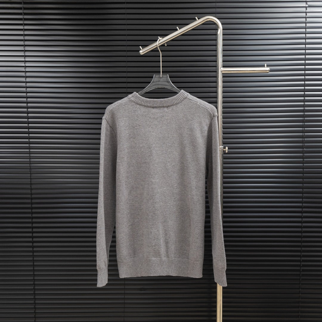 Prada long-sleeve sweater in heather gray with crew neck and ribbed cuffs.