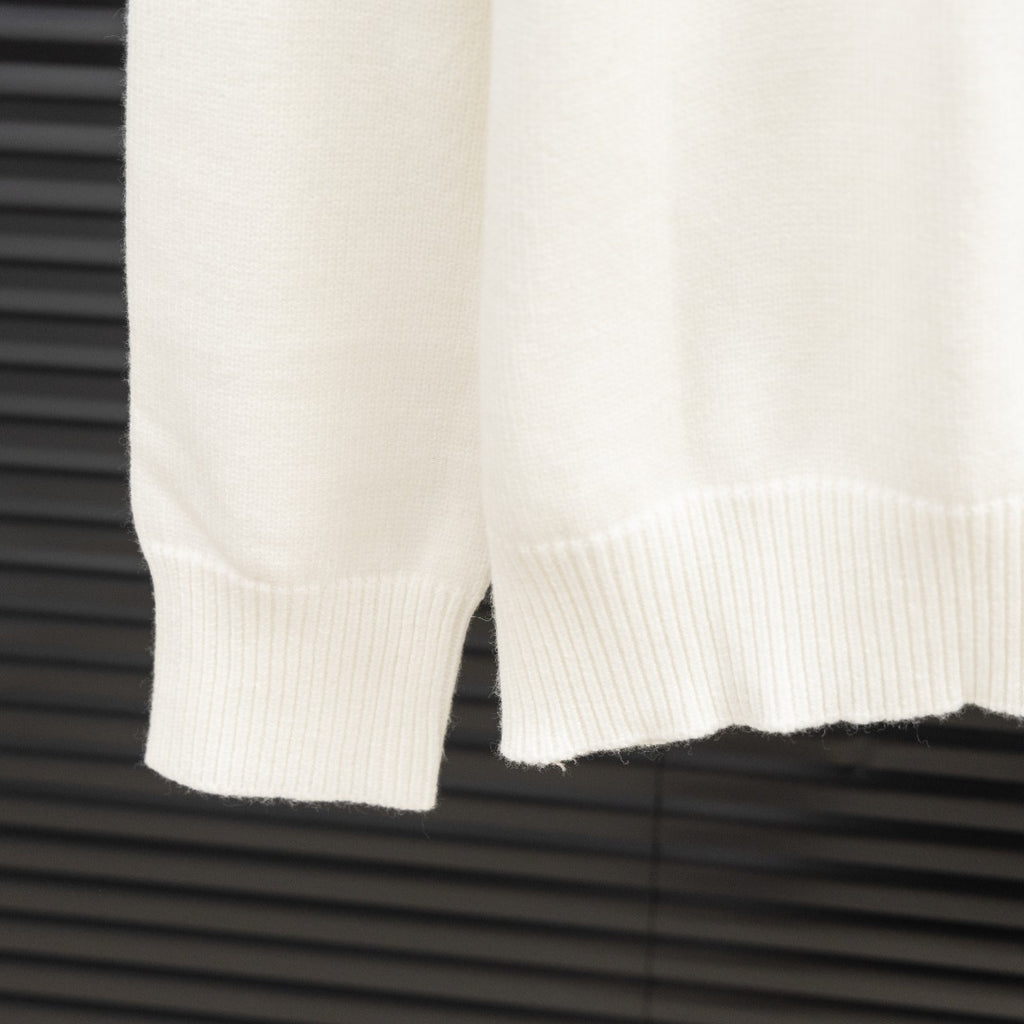 White Givenchy sweater sleeve with ribbed cuff and hem