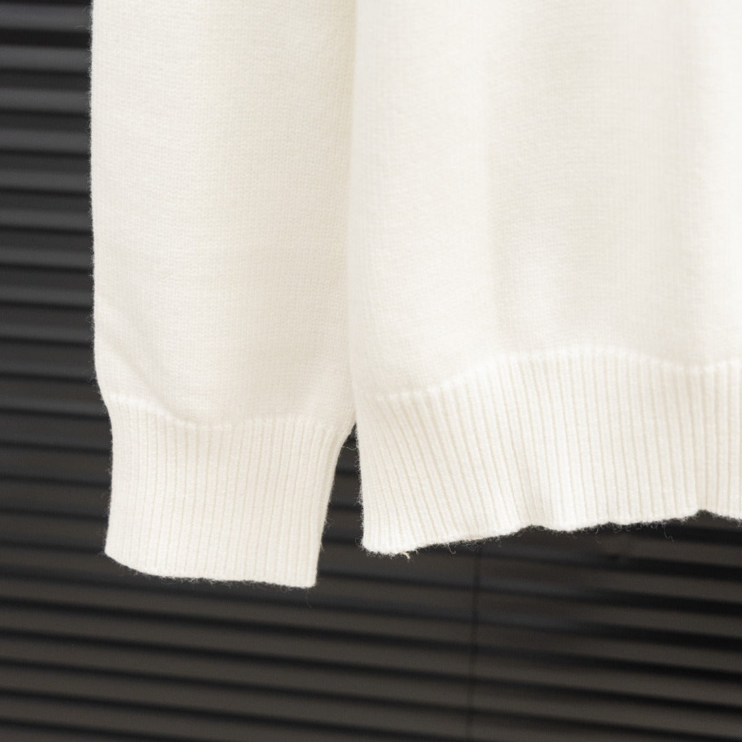 White Givenchy sweater sleeve with ribbed cuff and hem