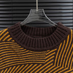 Long-sleeve sweater neckline detail: dark ribbed turtleneck and striped knit