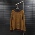 Long-sleeve sweater with dark turtleneck and brown/yellow geometric knit pattern