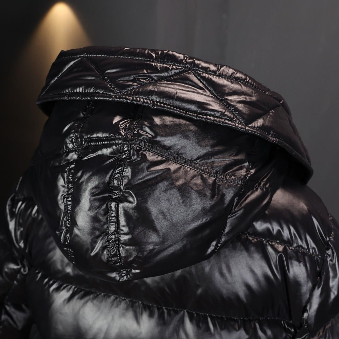 Hooded puffer coat close-up of hood lining and quilted black padding