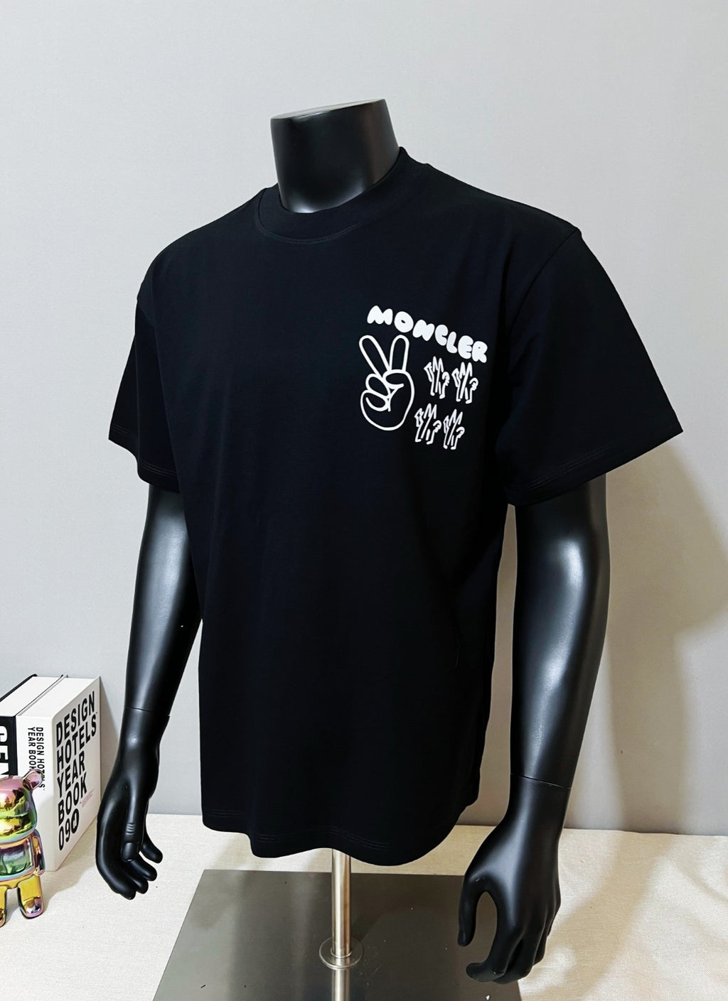 Dark navy Moncler graphic short-sleeve T-shirt on mannequin, chest print