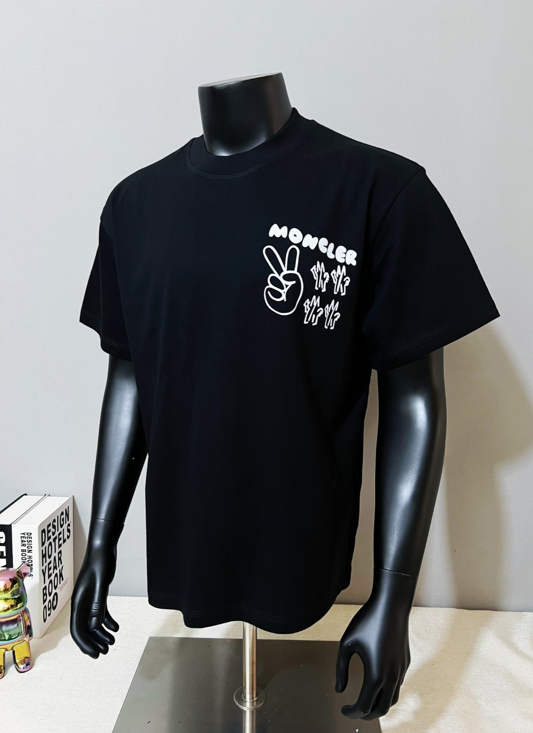 Dark navy Moncler graphic short-sleeve T-shirt on mannequin, chest print