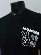 Dark navy short-sleeve T-shirt with white Moncler hand and text graphic