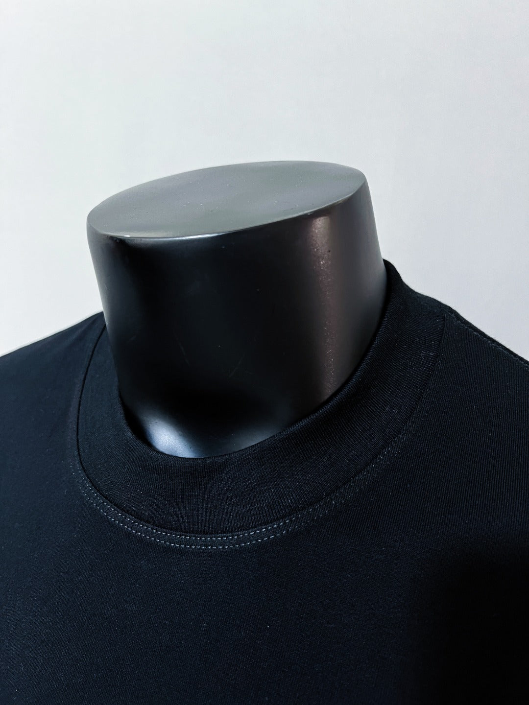 Dark navy crew-neck T-shirt collar detail
