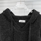 Stone Island hooded sweater neckline detail with small brand patch on chest