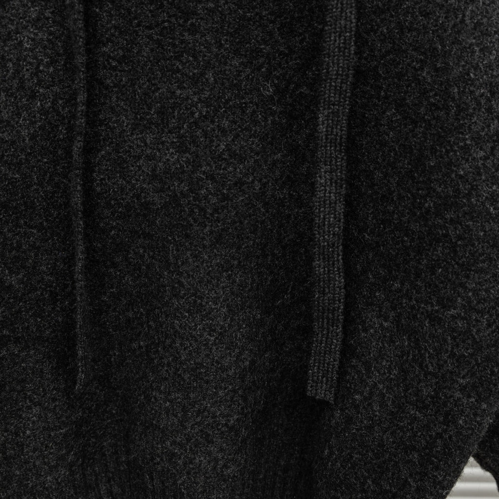 Stone Island hooded sweater fabric close-up with ribbed knit and stitched panel