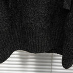Stone Island hooded sweater ribbed cuff and knit texture close-up in dark charcoal