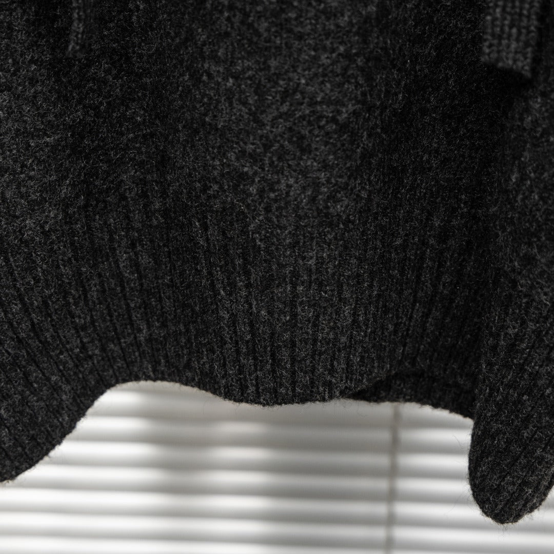 Stone Island hooded sweater ribbed cuff and knit texture close-up in dark charcoal