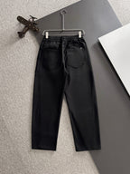 Black Gucci pants with pleated front, elastic waist, and two front pockets