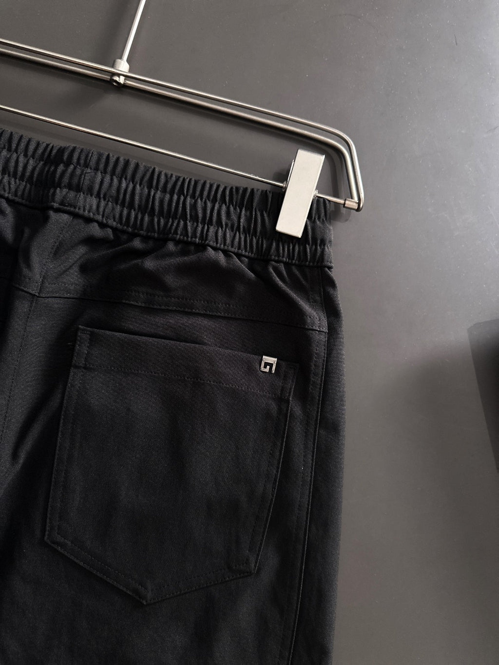 Black Gucci pants back pocket and tonal logo on front