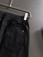 Black Gucci pants back pocket and tonal logo on front