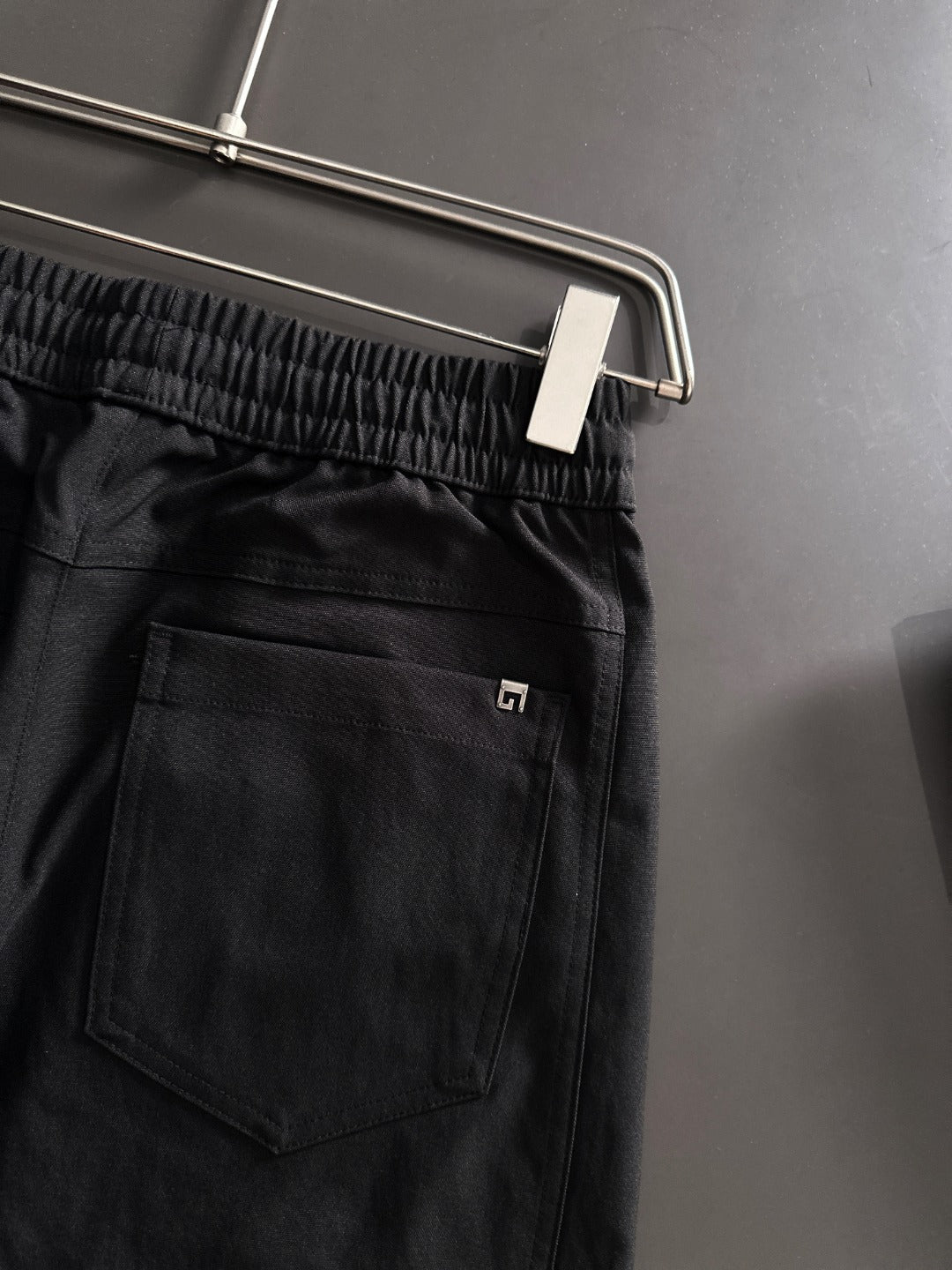 Black Gucci pants back pocket and tonal logo on front