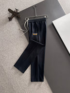 Navy straight pants on hanger with elastic waistband and FENDI logo patch
