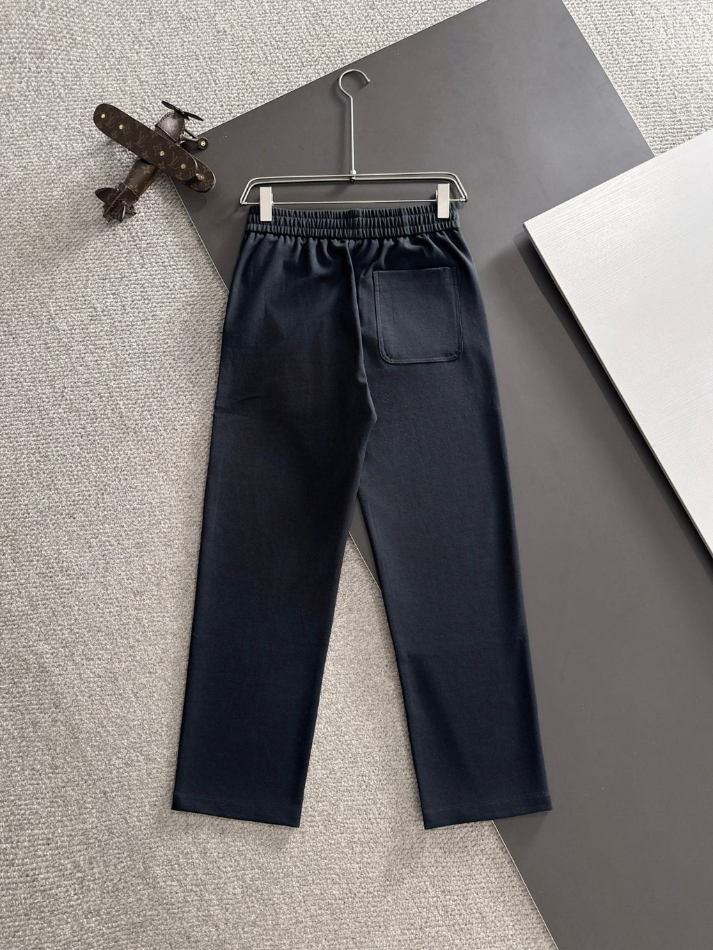 Navy FENDI pants with elastic waistband, drawstring, and front patch pockets