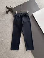 Navy FENDI pants with elastic waistband, drawstring, and front patch pockets