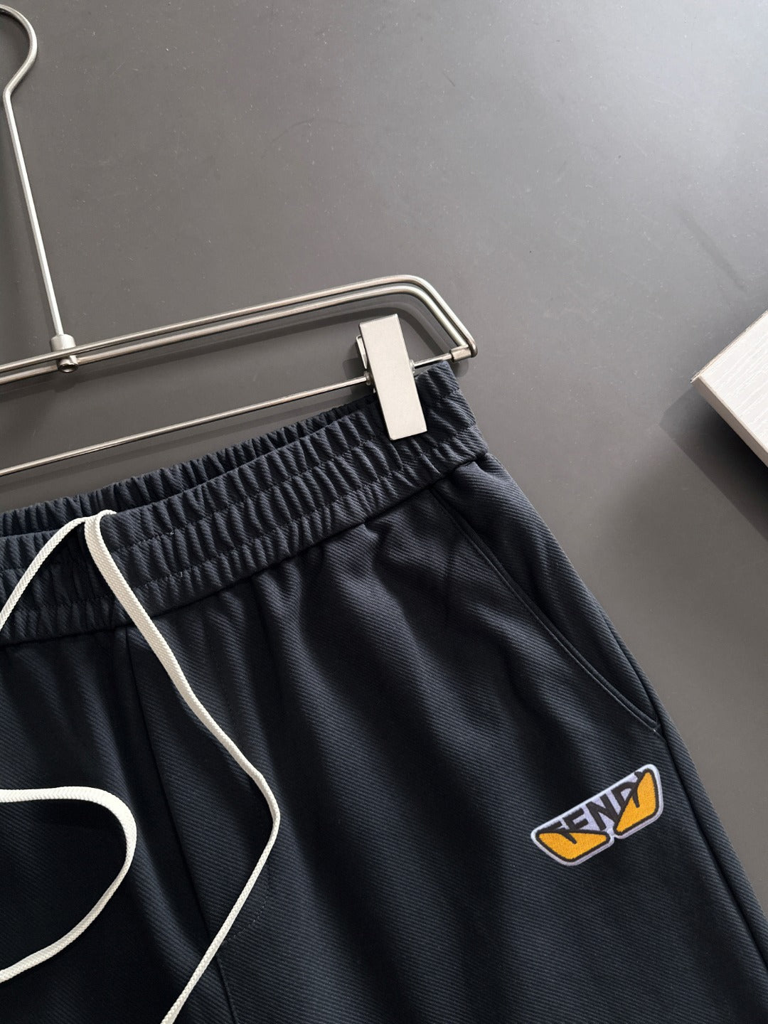 Navy pants waist with elastic waistband and drawstring ties, FENDI logo patch