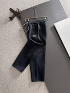 Dark navy jogger pants with drawstring and elastic waistband, Versace logo patch