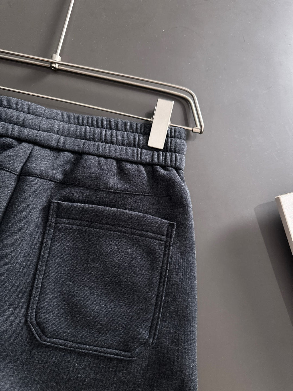 Dark jogger pants with patch pocket and stitched panel detailing