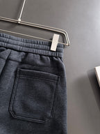 Dark jogger pants with patch pocket and stitched panel detailing