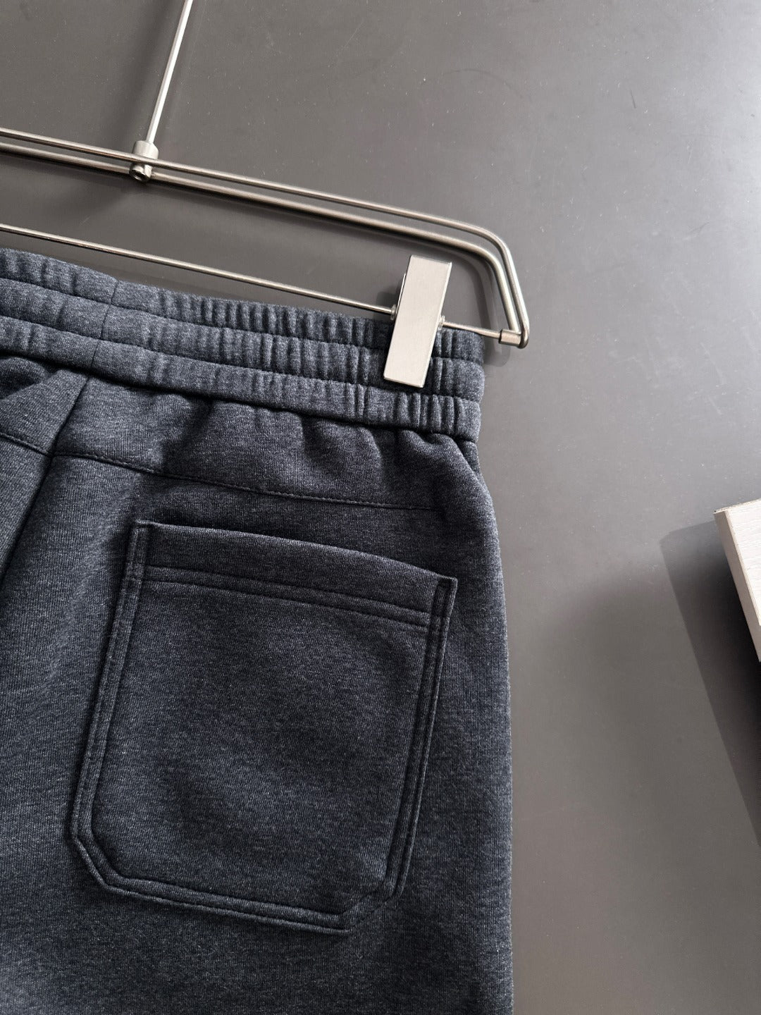 Dark jogger pants with patch pocket and stitched panel detailing