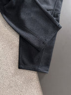 Dark jogger pants with side seam and slanted pocket openings