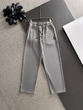 Stone Island light gray sweatpants with elastic waist, drawstring, and side pockets