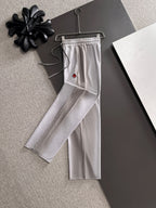 Light gray drawstring pants, long straight legs, Moncler logo patch