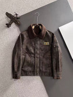 Brown shearling-collar jacket with front zipper and chest logo patch