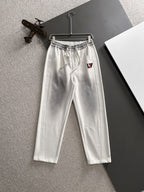 Louis Vuitton pants in white with elastic waistband, drawstring, and front patch pockets