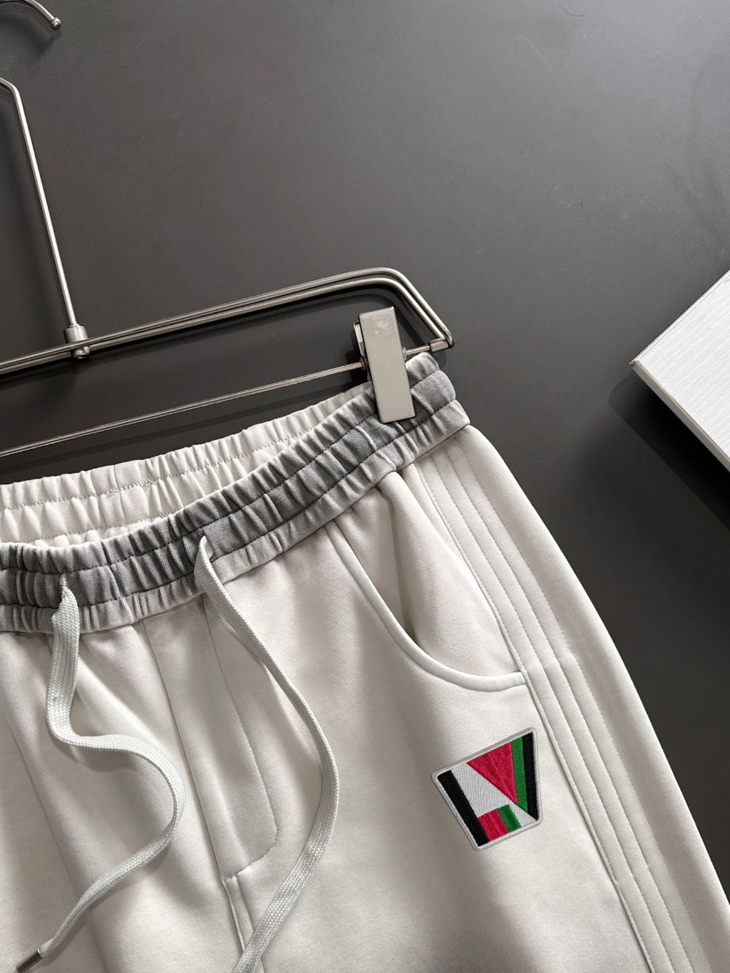 Louis Vuitton pants with elastic waistband and multicolor LV logo patch, front pocket