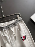 Louis Vuitton pants with elastic waistband and multicolor LV logo patch, front pocket