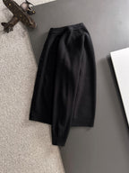 Black cardigan jacket with long sleeves and button front