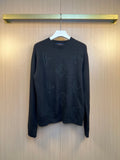 Dark knit sweater with embroidered monogram pattern