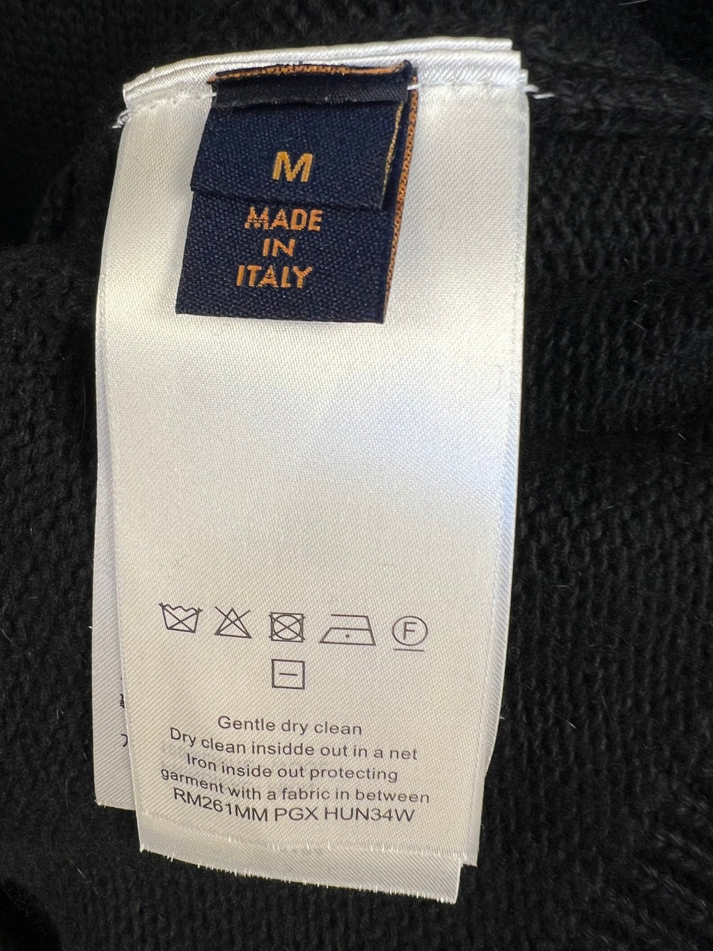 Knit sweater care label: size M, Made in Italy, dry clean