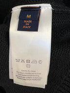 Knit sweater care label: size M, Made in Italy, dry clean