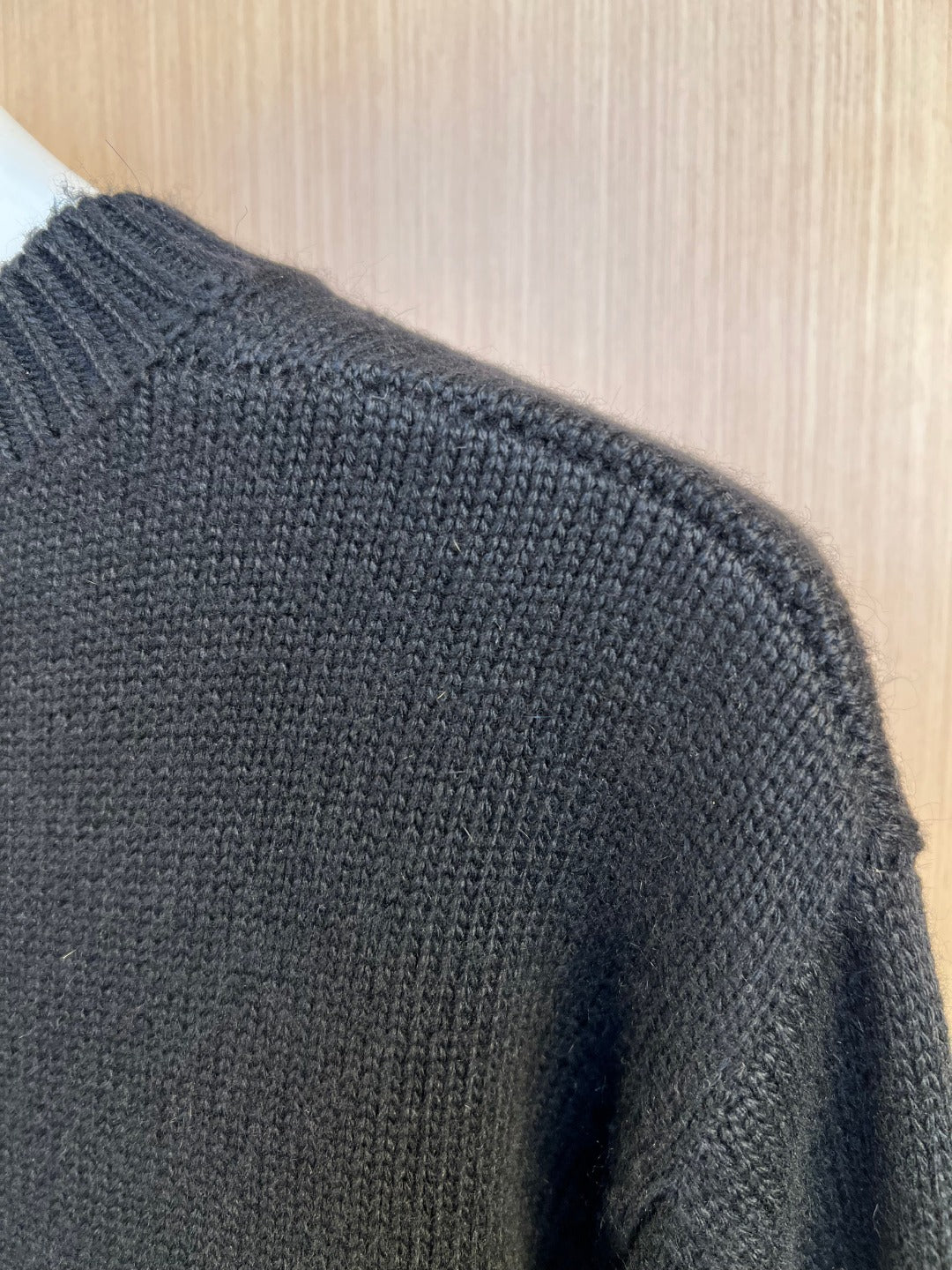 Charcoal knit sweater back with textured knit and ribbed shoulder