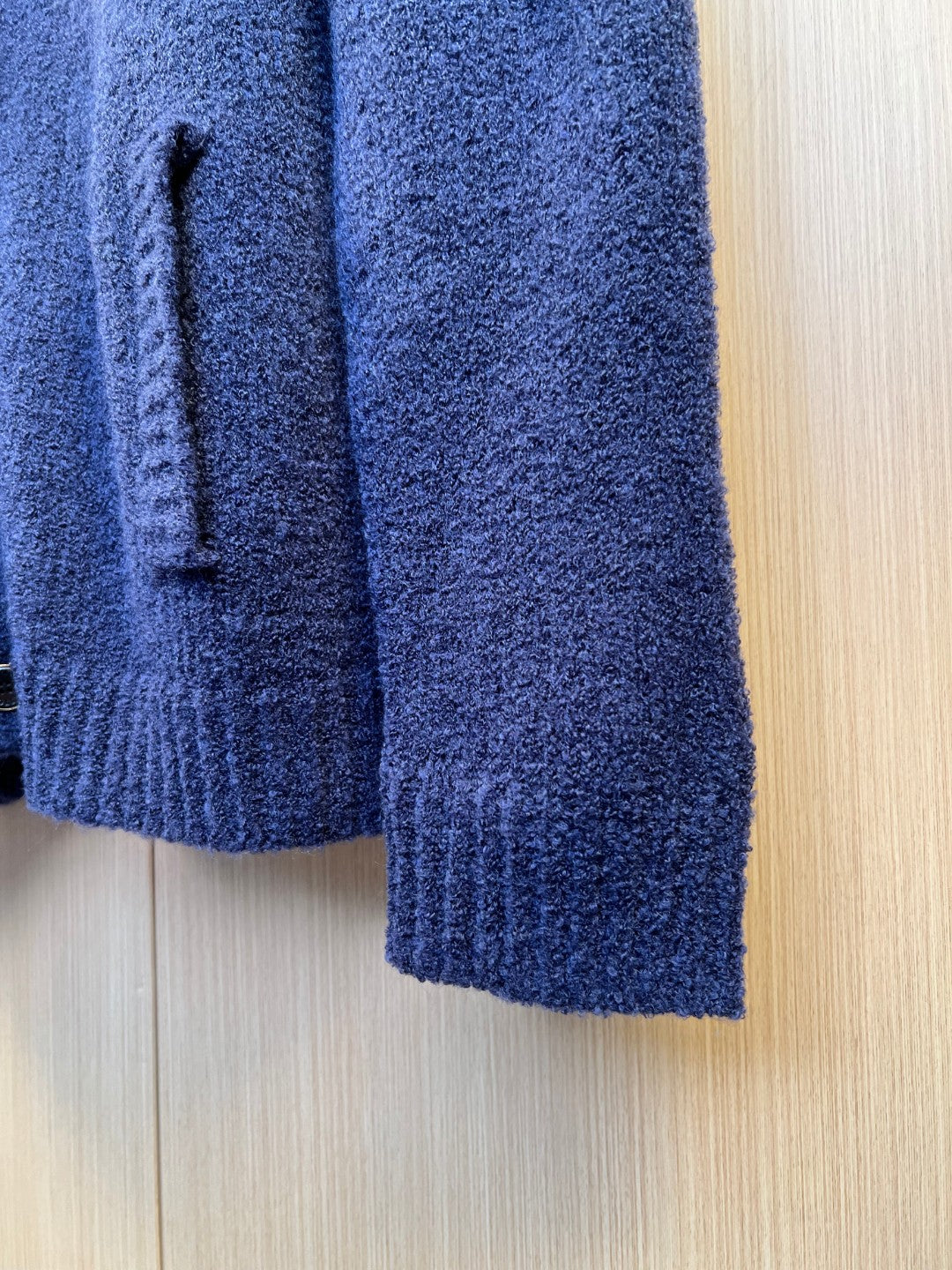 Navy knit cardigan sleeve with ribbed cuff and textured knit