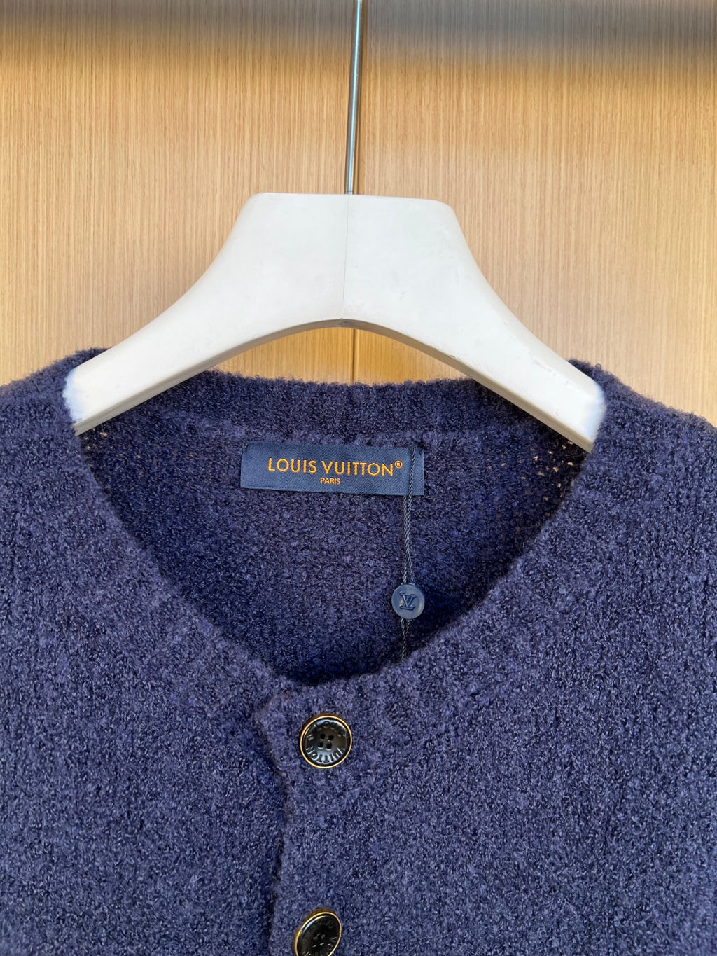 Louis Vuitton navy knit cardigan neckline with button placket and gold-tone buttons