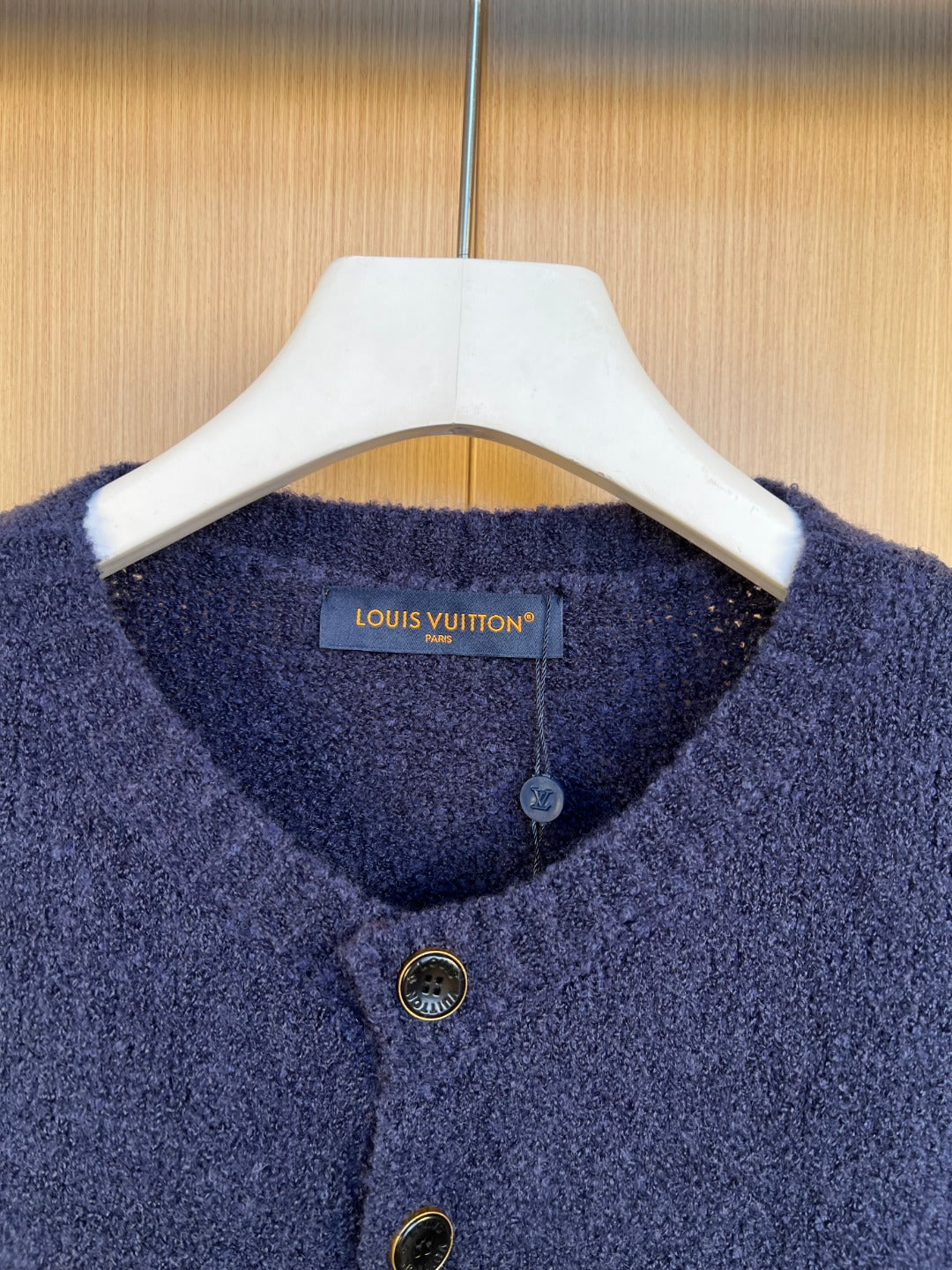 Louis Vuitton navy knit cardigan neckline with button placket and gold-tone buttons