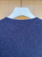 Navy knit cardigan back close-up with textured fabric