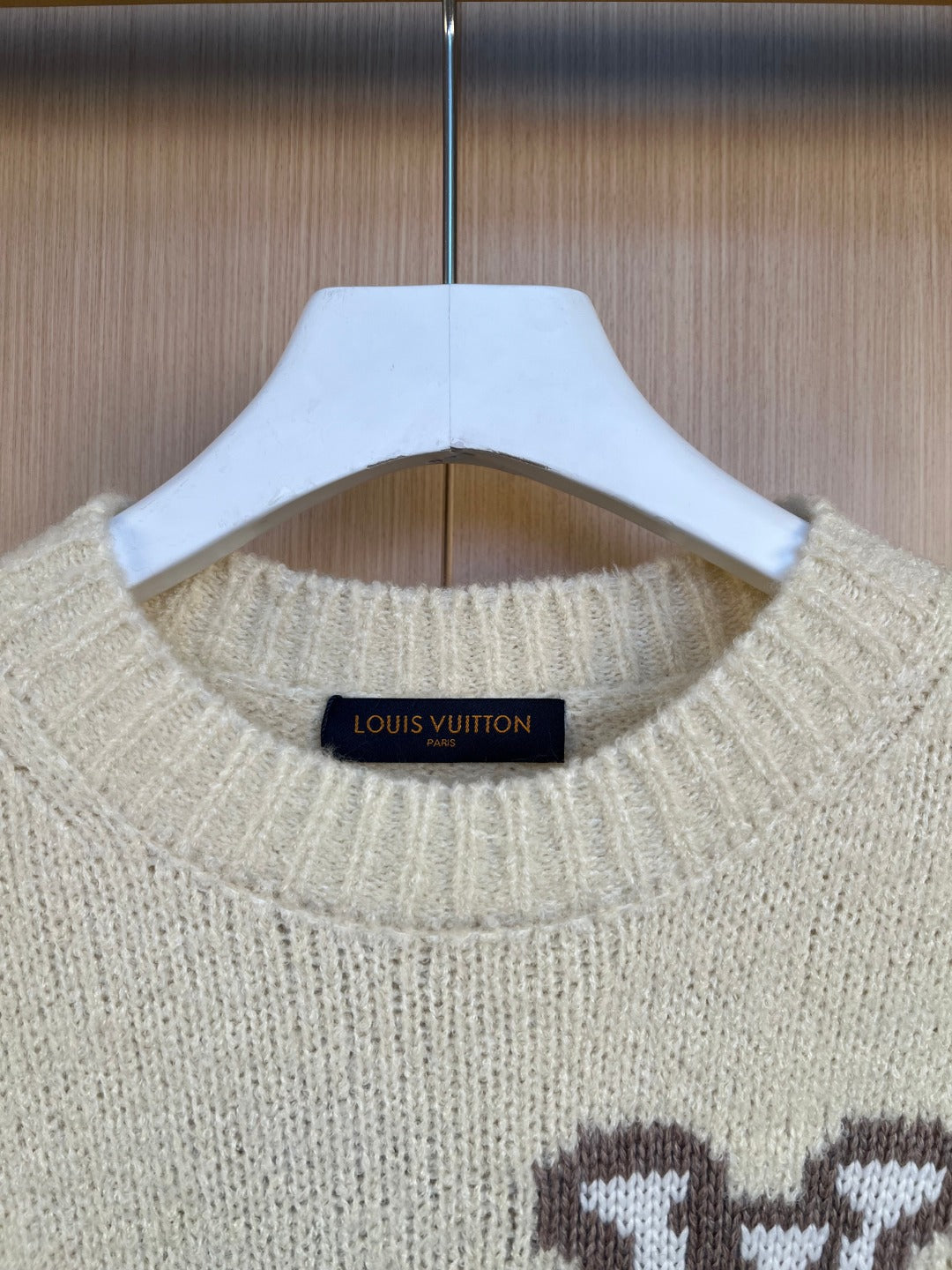 Light cream knit sweater collar with neckline ribbing and small Louis Vuitton label